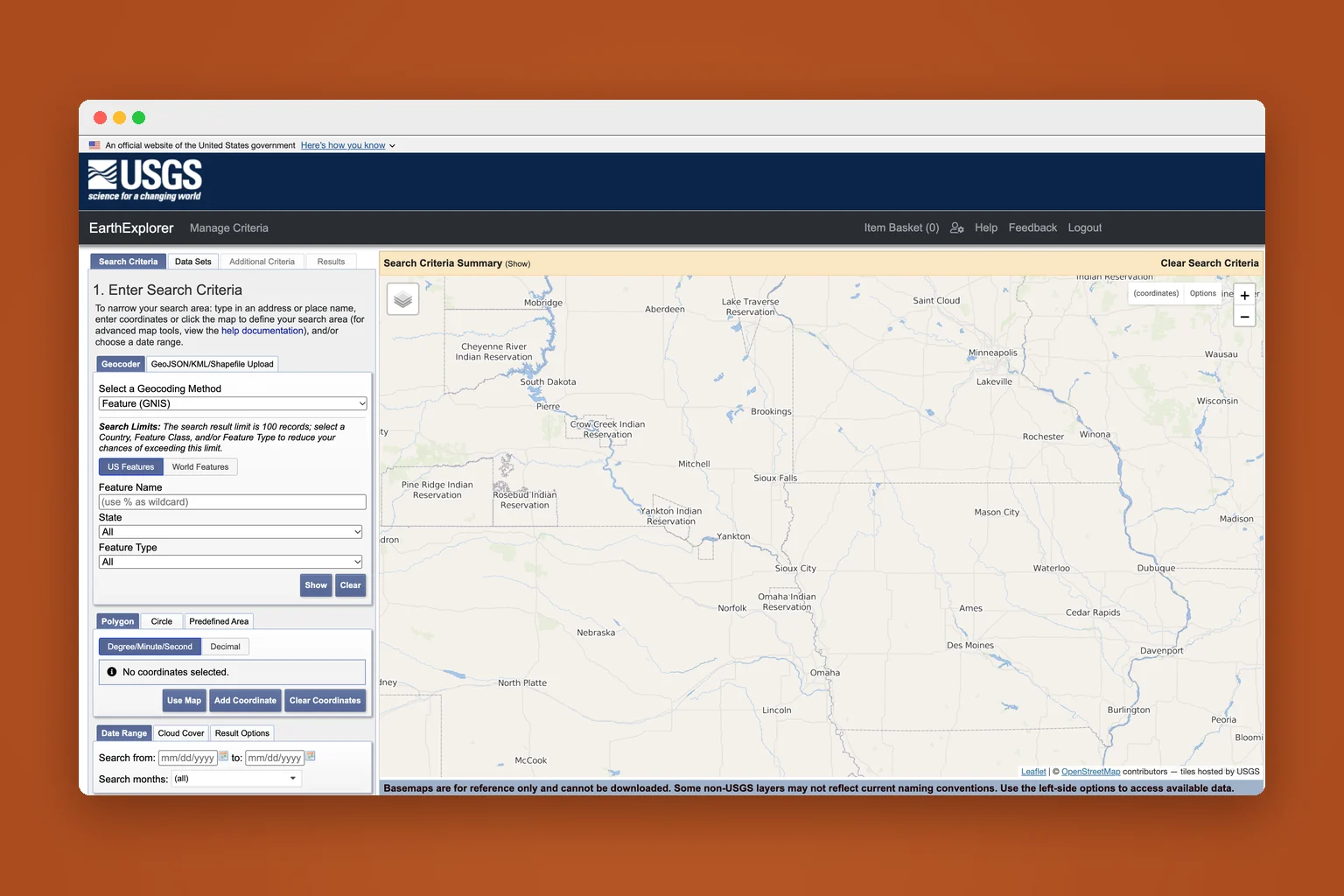 USGS EarthExplorer search screen: a search criteria panel with tabs and form fields beside a large map.